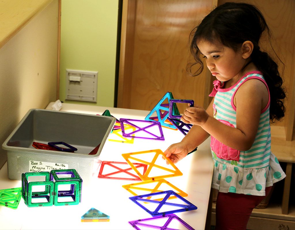 Student completes puzzle activity at the UD Lab School