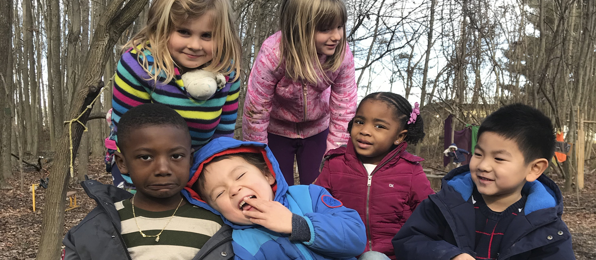 Six Lab School kindergarten students outside