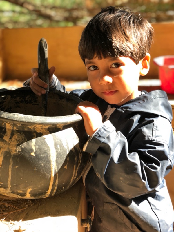 Smiling child in the outdoor classroom at the UD Lab School