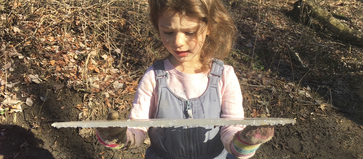 Student in UD Lab School's outdoor classroom