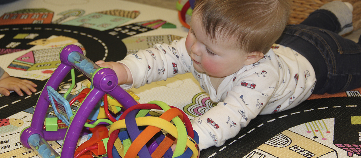 Baby playing with toy at UD Lab School